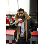 Man wearing a brown aviator jacket in the city