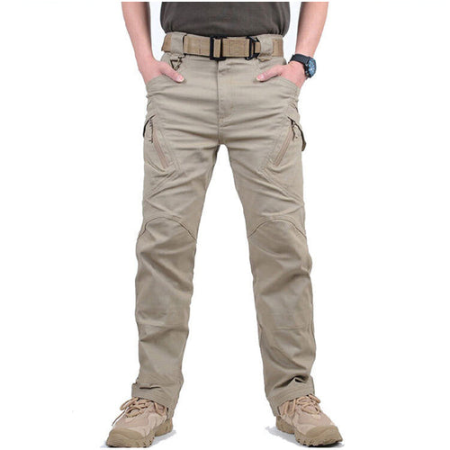Man wearing khaki cargo trousers with multiple pockets, front view
