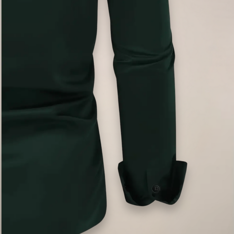 Close-up of the button cuff on the dark green shirt