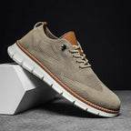 Men's beige textured lace-up shoe with white sole, side view