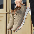 Beige lace-up shoes worn with light jeans