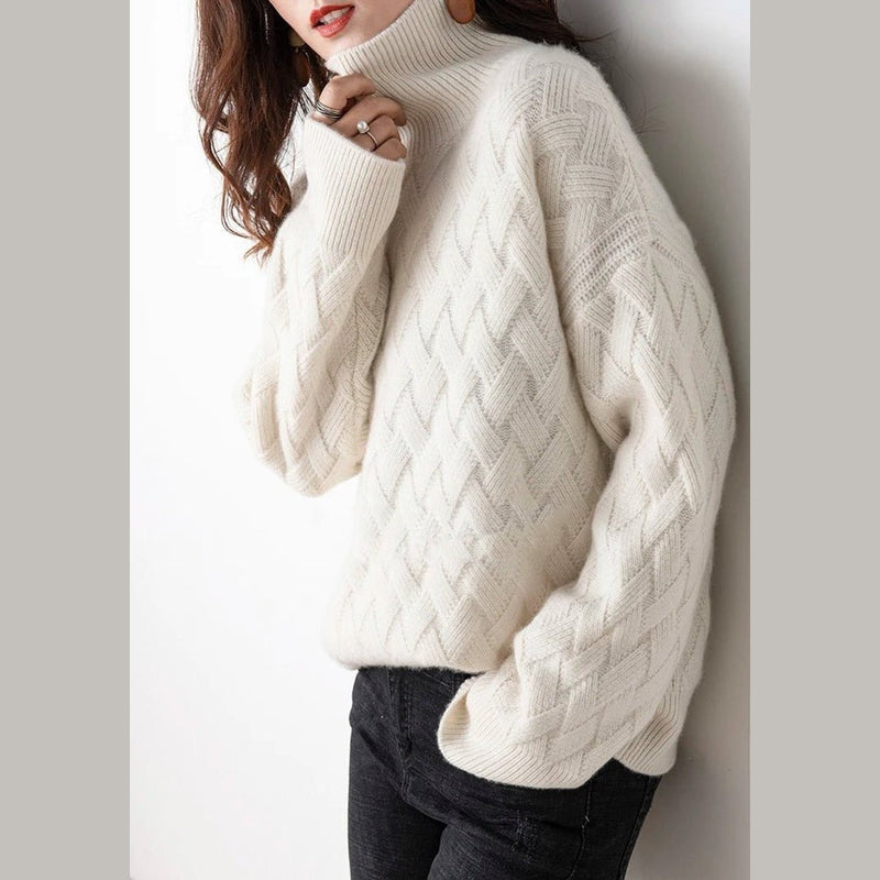 Women's cable knit turtleneck sweater in cream – front view