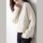 Women's cable knit turtleneck sweater in cream – front view