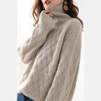 Women's cable knit turtleneck sweater in beige – front view