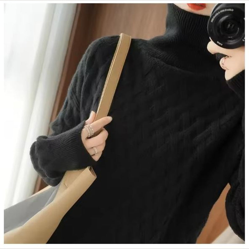 Women's cable knit turtleneck sweater in black – front view