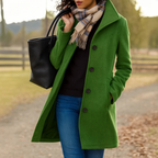 Woman wearing a moss green classic winter coat