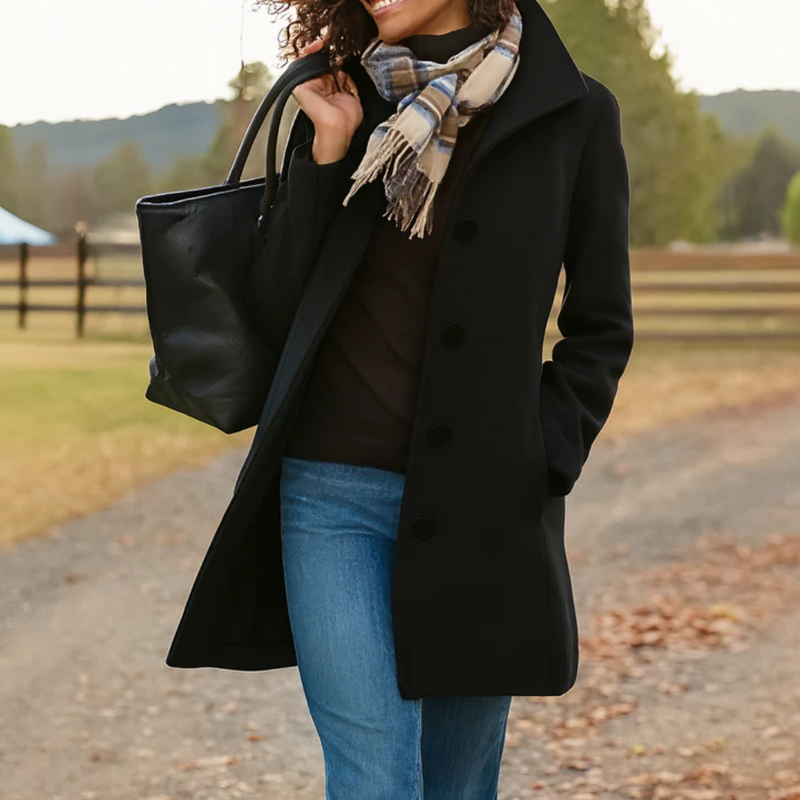 Woman wearing a black classic winter coat outdoors