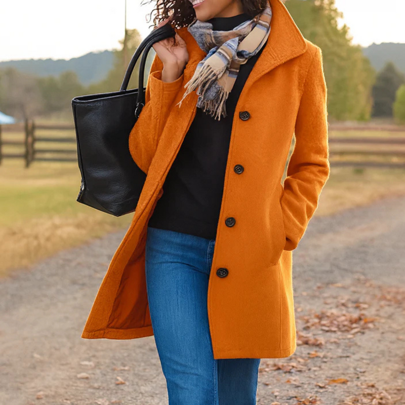 Woman wearing an orange button front winter coat
