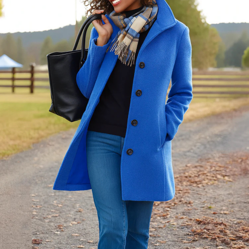 Woman in a blue classic winter coat outdoors