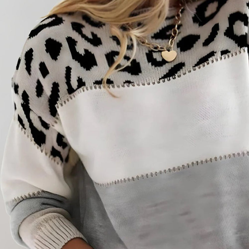Close-up of the leopard pattern on the gray color block sweater