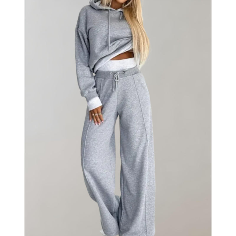 Woman wearing a gray hoodie and jogger set