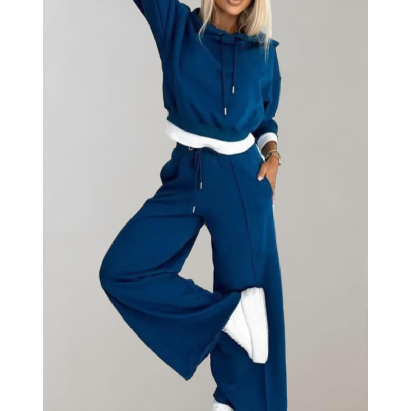 Woman in a navy blue hoodie and jogger set