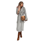 Women's long belted coat with lapel collar in light gray – front view