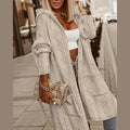 Women's long cable knit hooded cardigan in beige – front view