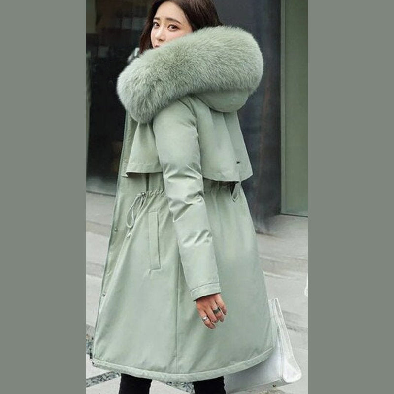 Women's long parka with faux fur hood in sage green – front view