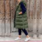 Women's long quilted hooded vest in army green – front view