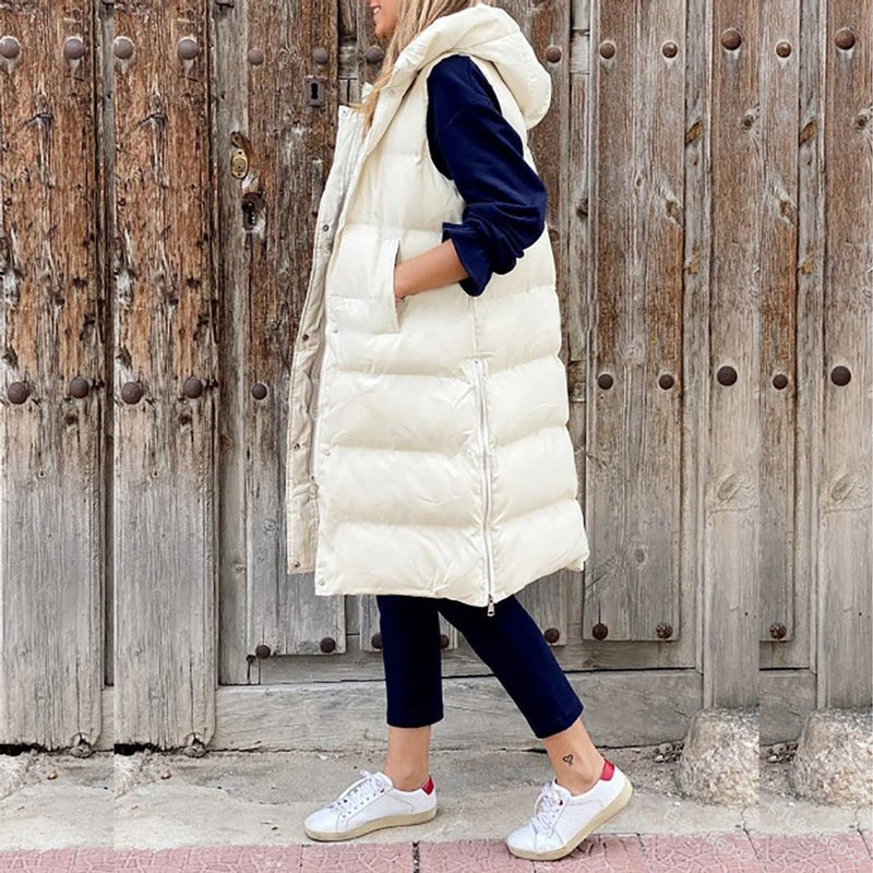Women's long quilted hooded vest in off white – front view