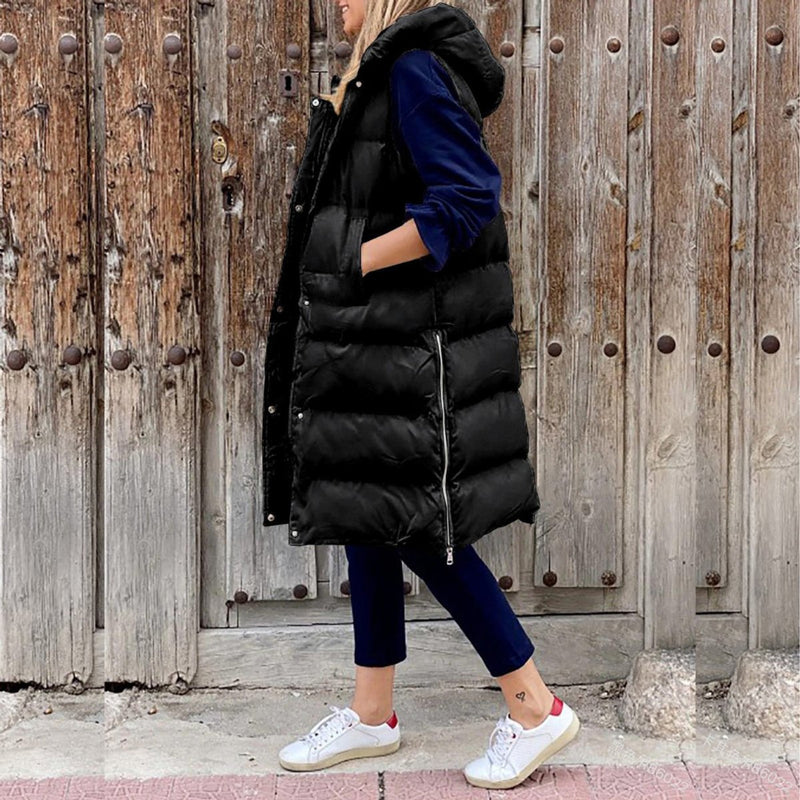 Women's long quilted hooded vest in black – front view