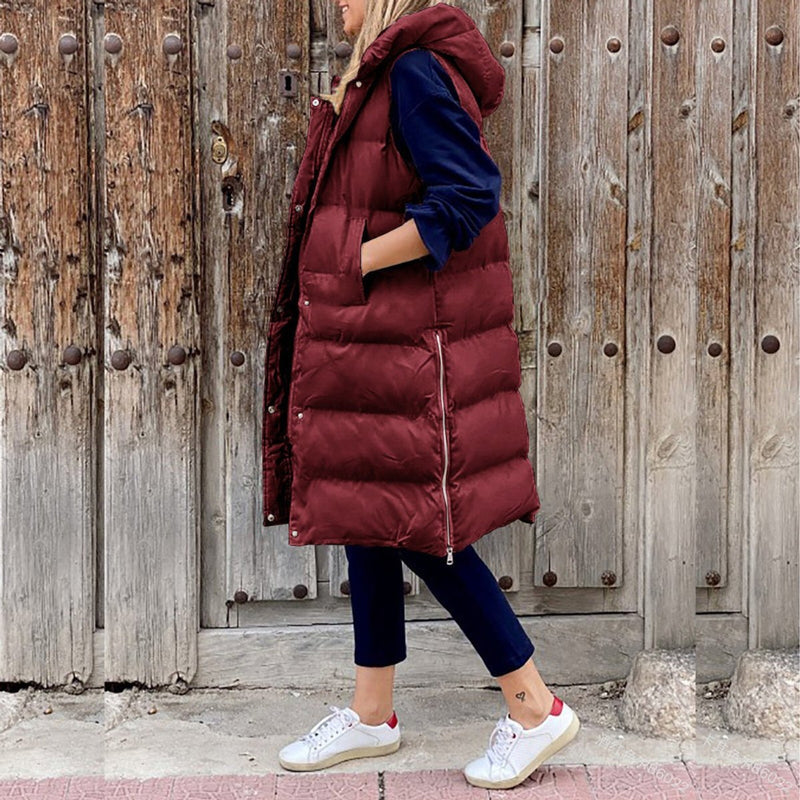Women's long quilted hooded vest in burgundy – front view