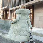 Back view of a mint green long quilted puffer coat