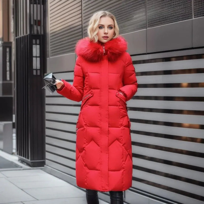 Woman in a red long quilted puffer coat with plush trim hood