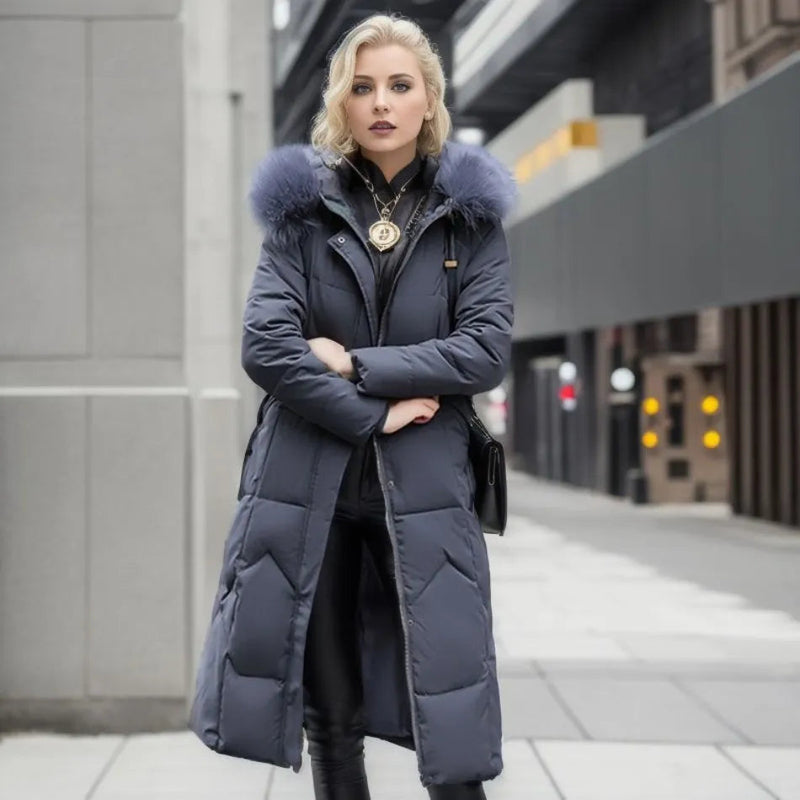 Woman wearing a dark gray long quilted puffer coat