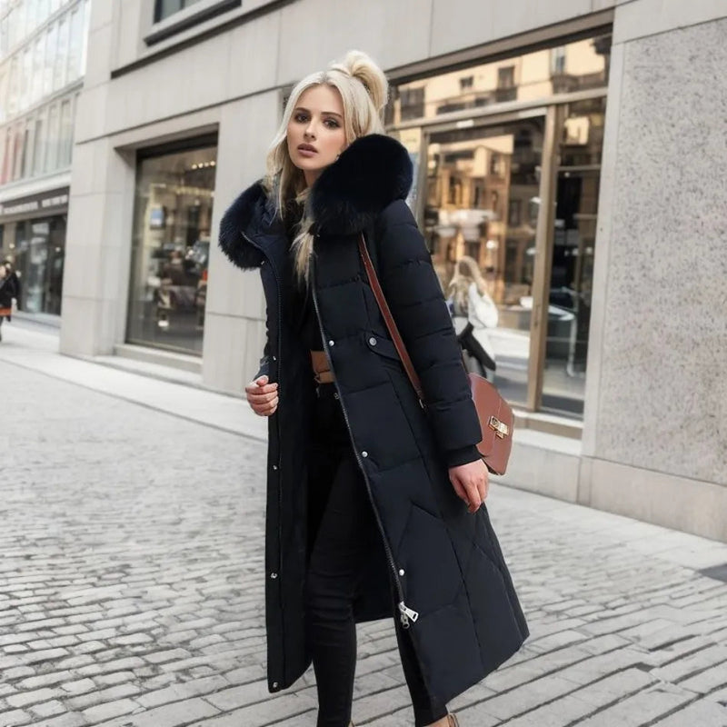 Woman wearing a black long quilted puffer coat with bag