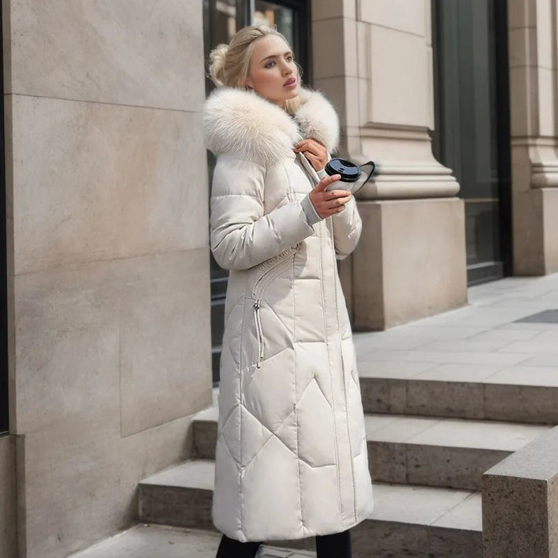Woman wearing a white long quilted puffer coat