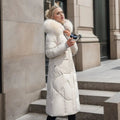 Woman wearing a white long quilted puffer coat