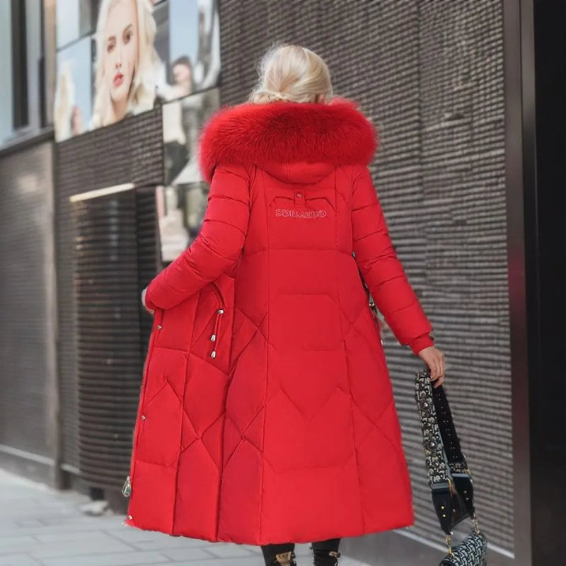 Back view of a red long quilted puffer coat with plush hood