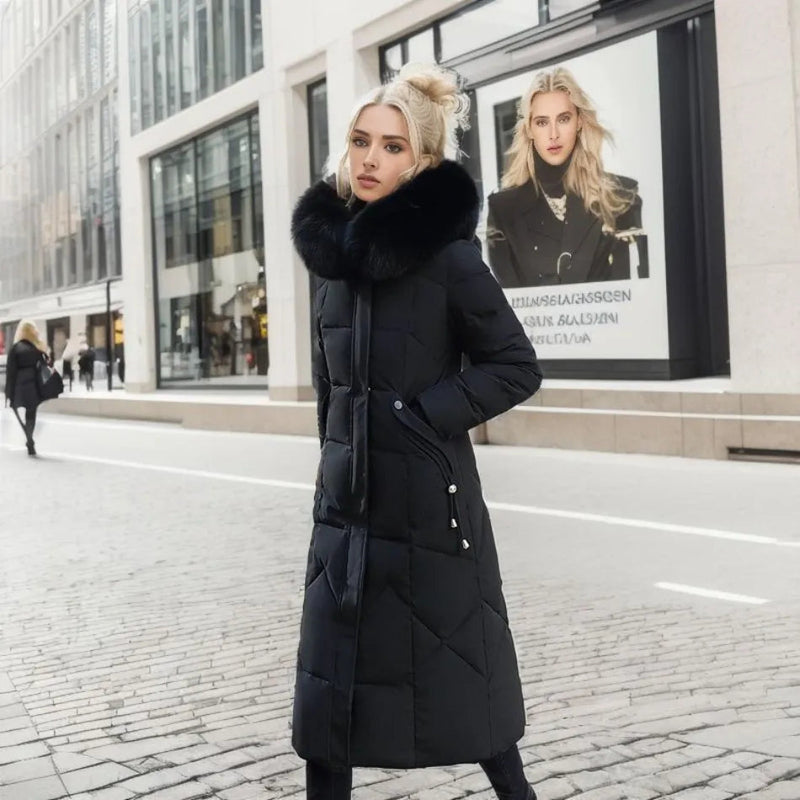 Woman in a black long quilted puffer coat walking in the city