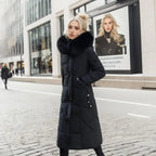 Woman in a black long quilted puffer coat walking in the city