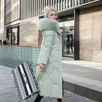 Woman in a mint green long quilted puffer coat