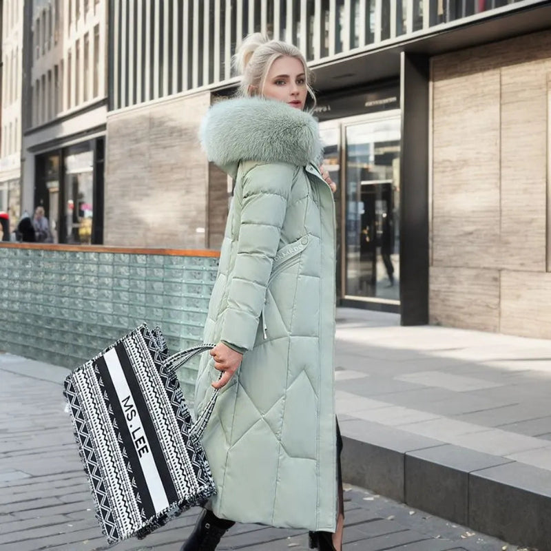 Woman in a mint green long quilted puffer coat
