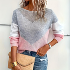 Woman wearing a pink and gray loose fit color block sweater