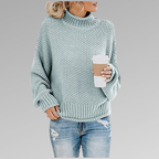 Woman in a sky blue loose knit sweater