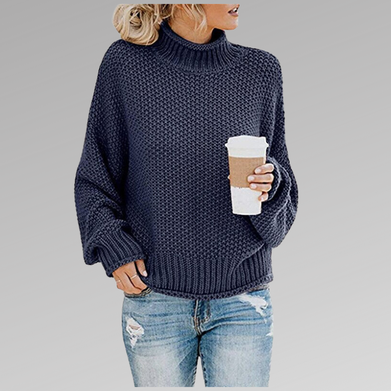 Woman wearing a navy blue loose knit sweater