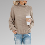 Woman wearing a beige loose knit sweater