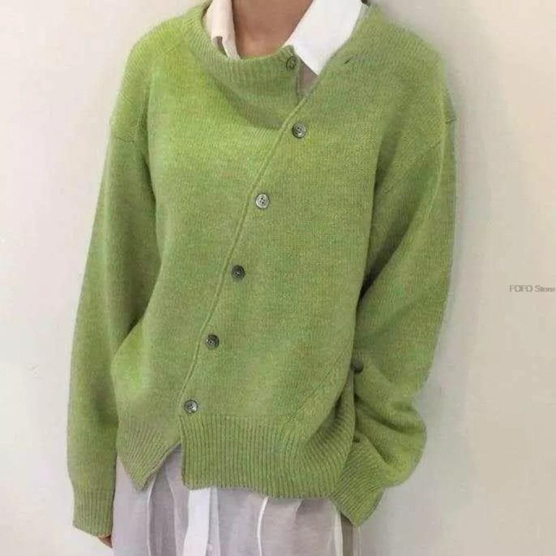 Women's oversized cardigan with asymmetric buttons in green – front view
