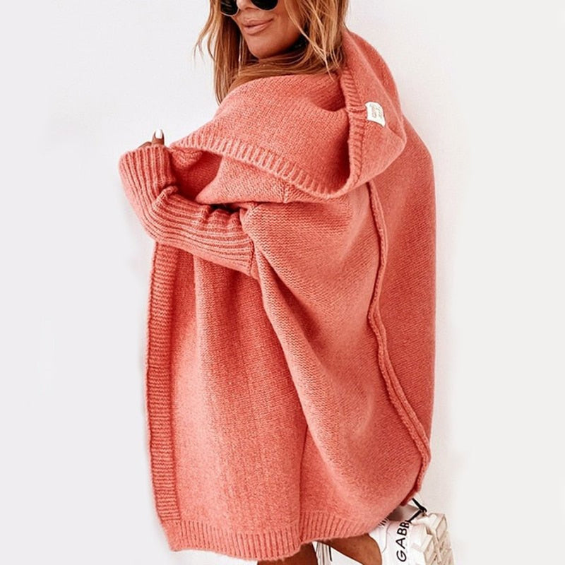 Women's oversized hooded cardigan with batwing sleeves in coral – front view