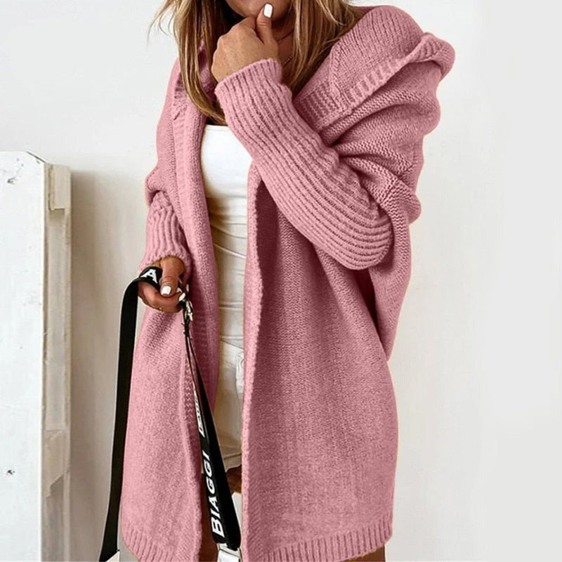 Women's oversized hooded cardigan with batwing sleeves in pink – front view