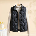 Women's quilted vest with stand collar in black – front view