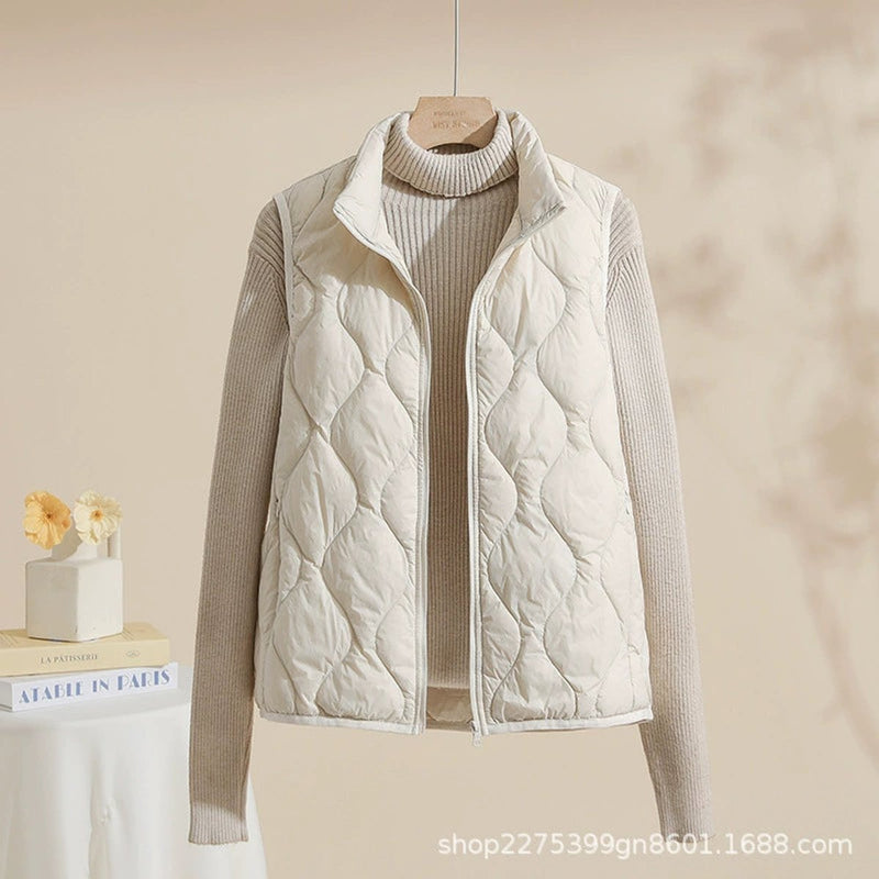 Women's quilted vest with stand collar in cream – front view
