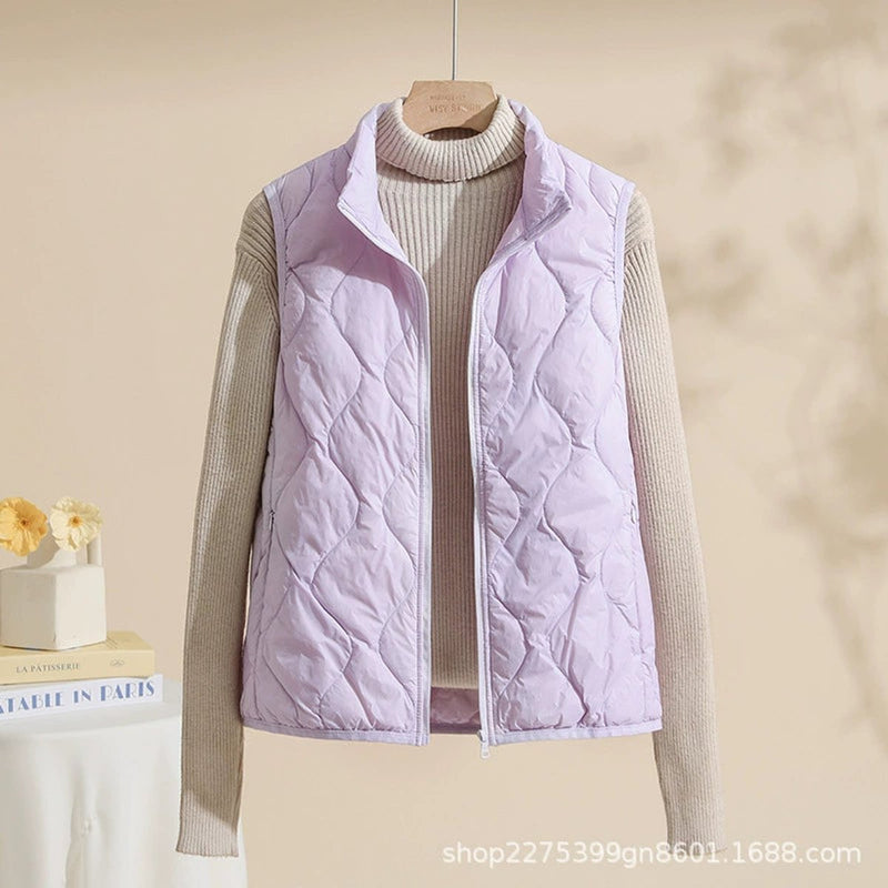 Women's quilted vest with stand collar in light purple – front view