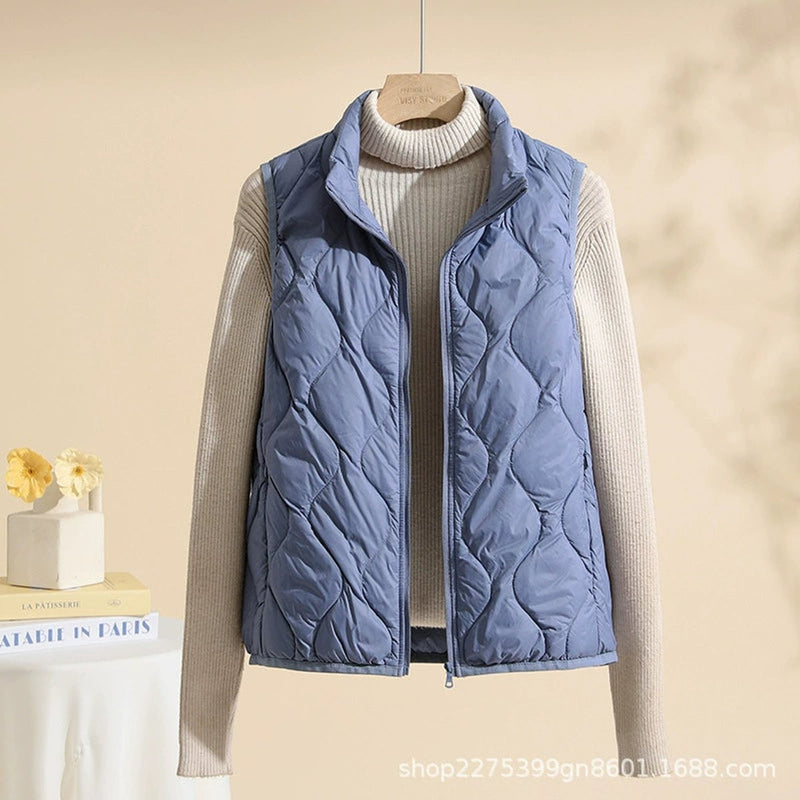 Women's quilted vest with stand collar in light blue – front view