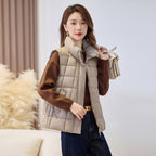Women's quilted zip vest with high collar in apricot – front view