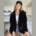 Women's short faux fur coat with lapel collar in black – front view
