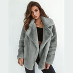 Women's short faux fur coat with lapel collar in gray – front view