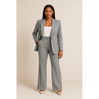 Woman in a gray tailored blazer and trousers set