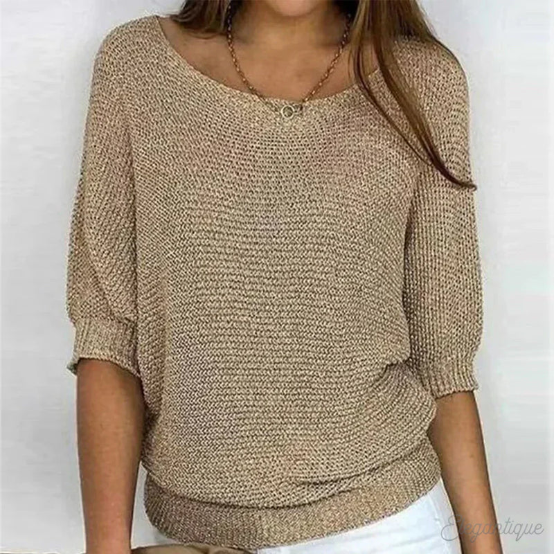 Woman wearing a beige textured knit sweater